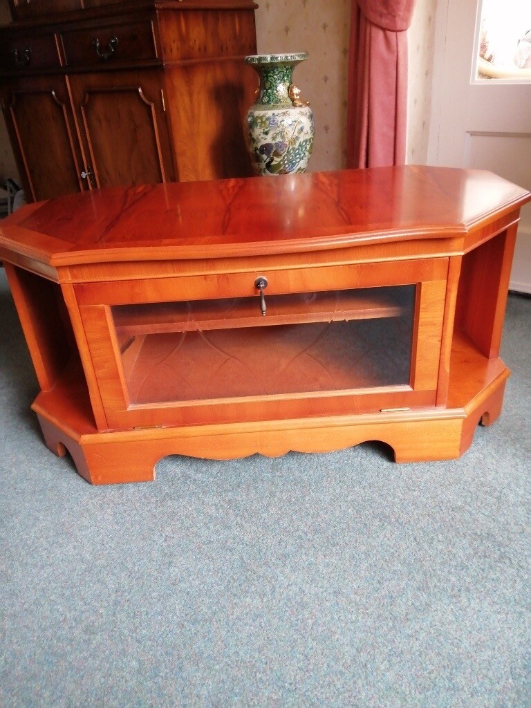 Yew television with glass front and shelves in Poynton