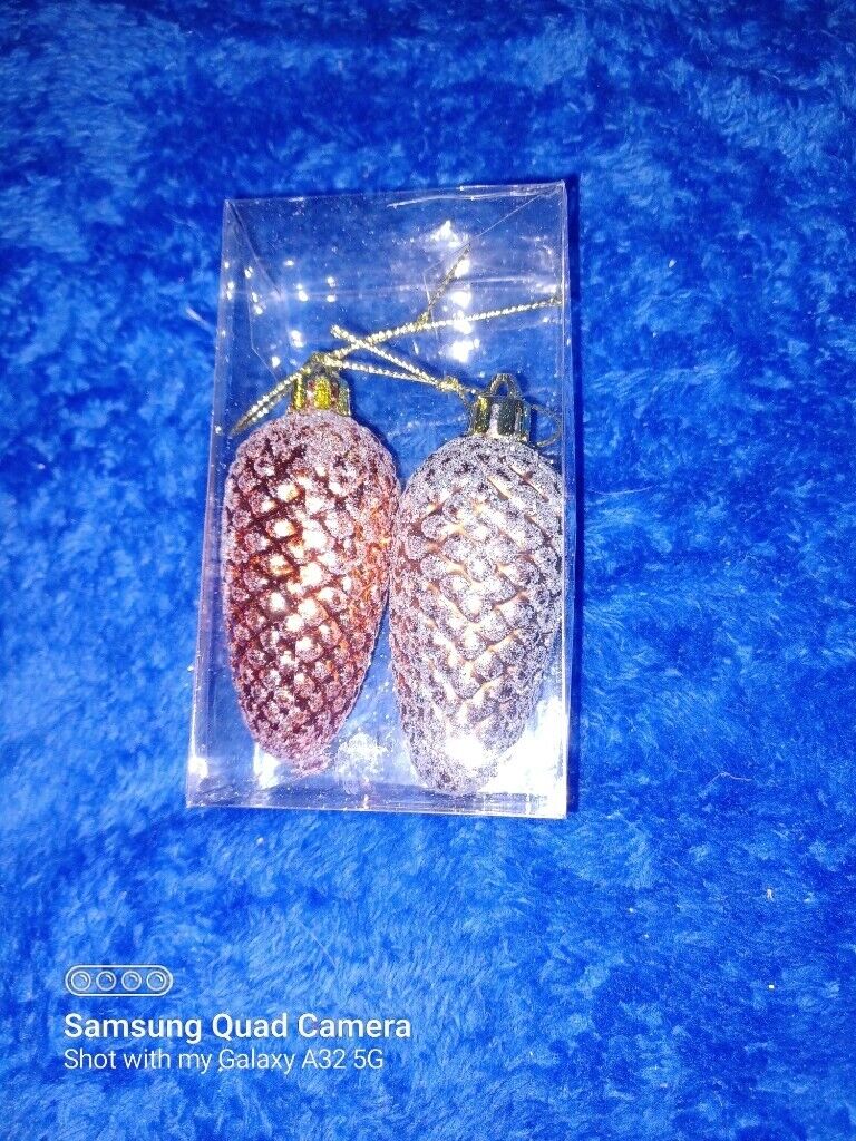 Two large pinecone design Christmas decorations
