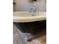 Victorian style roll top bath with chrome claw feet