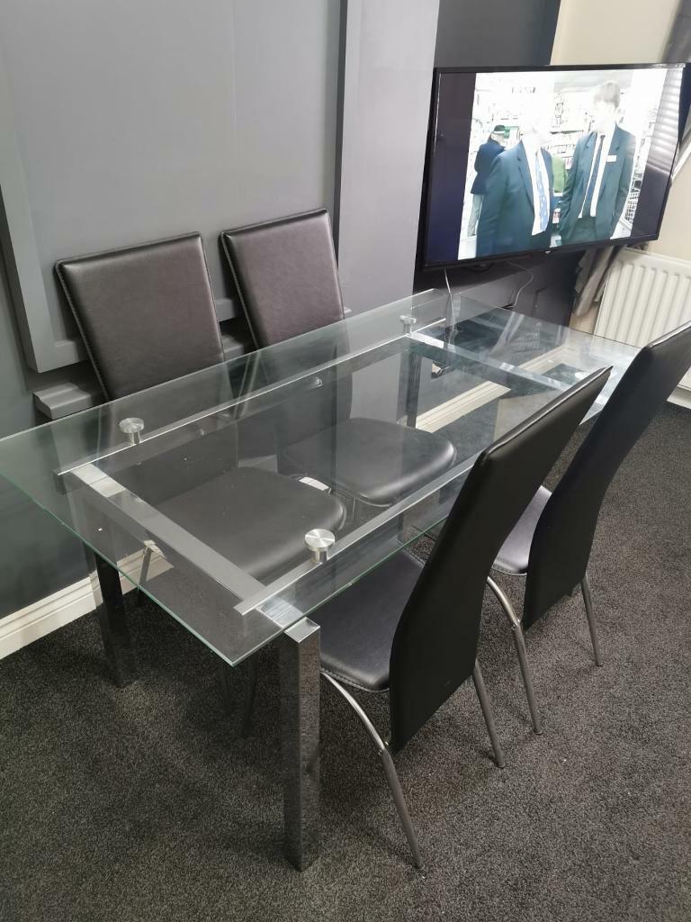 Glass table with 6 chairs in