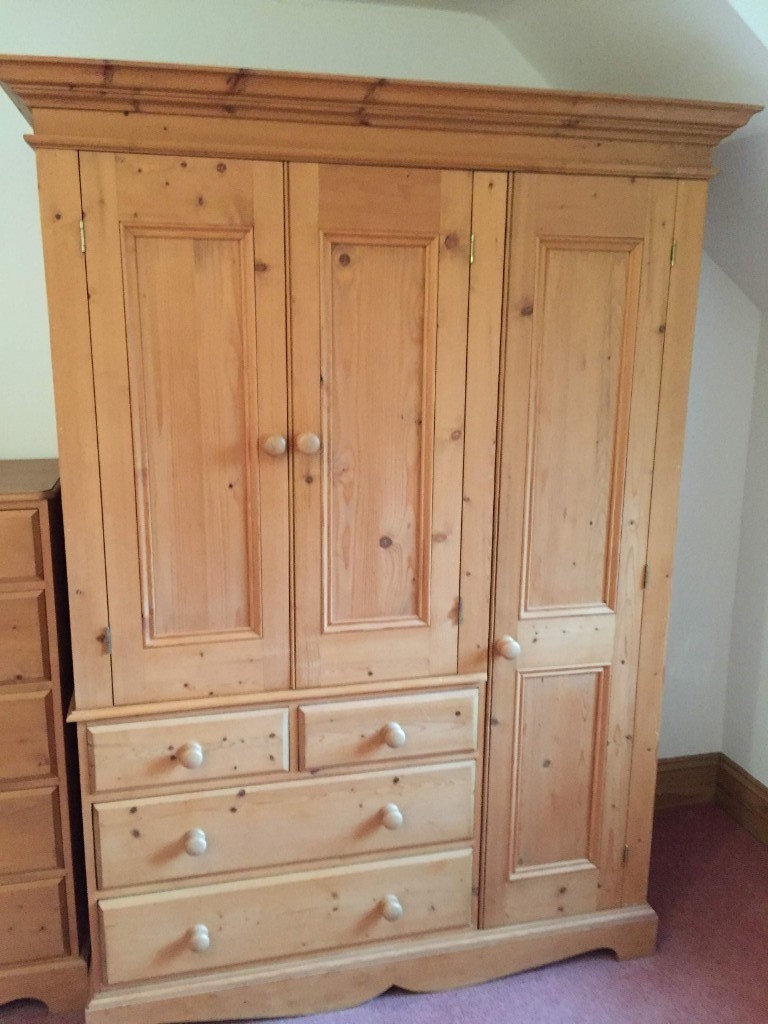 An Antique Pine, Double Wardrobe with Chest of Drawers and Shelving in