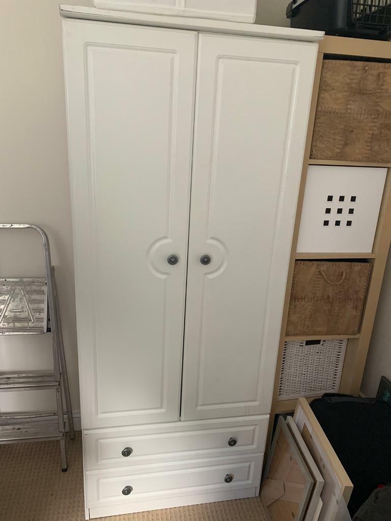 Small white wooden wardrobe with drawers in Potton, Bedfordshire
