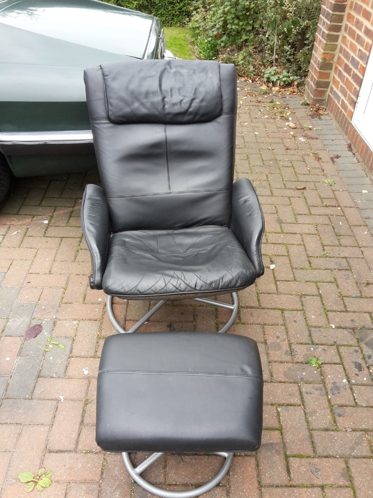 2 Ikea Malung black recliner swivel armchairs and footstools. in