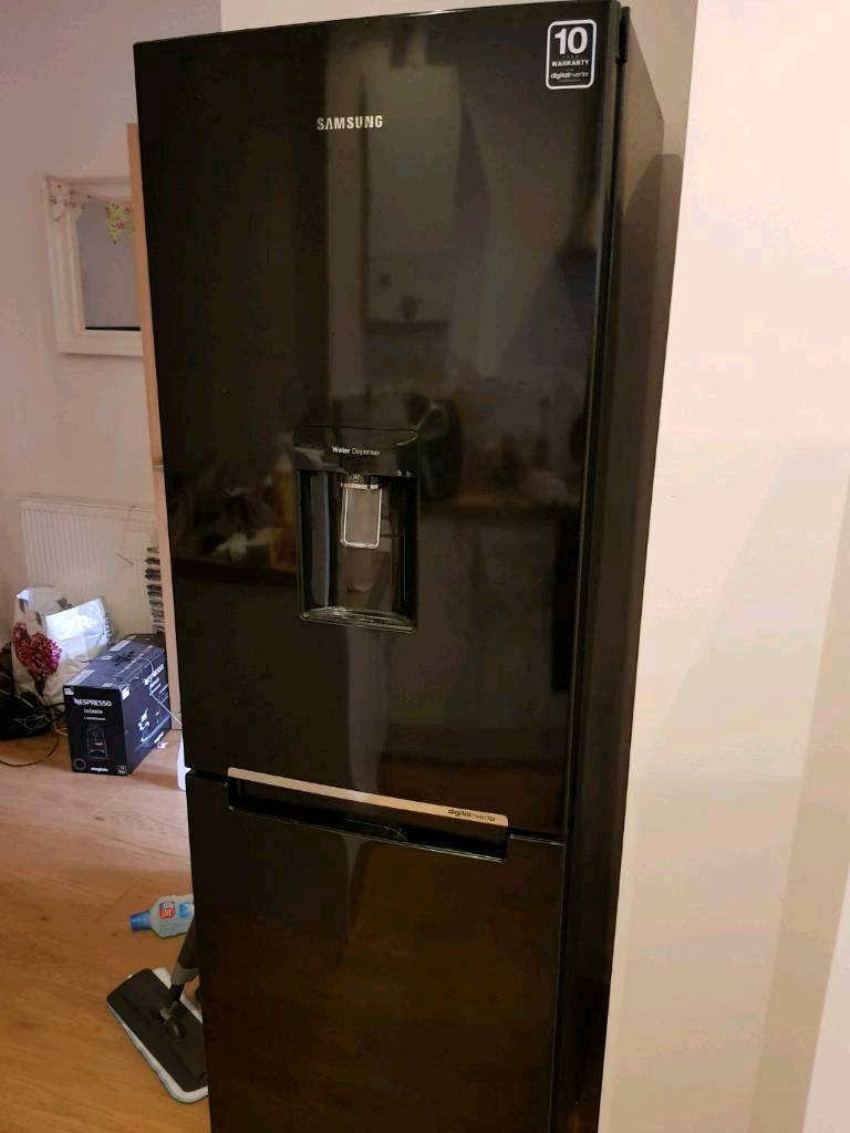 Black Samsung water dispenser frost free fridge freezer in Manchester