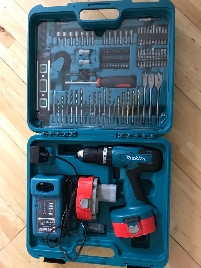 Makita cordless drill with spare battery, charger and comprehensive