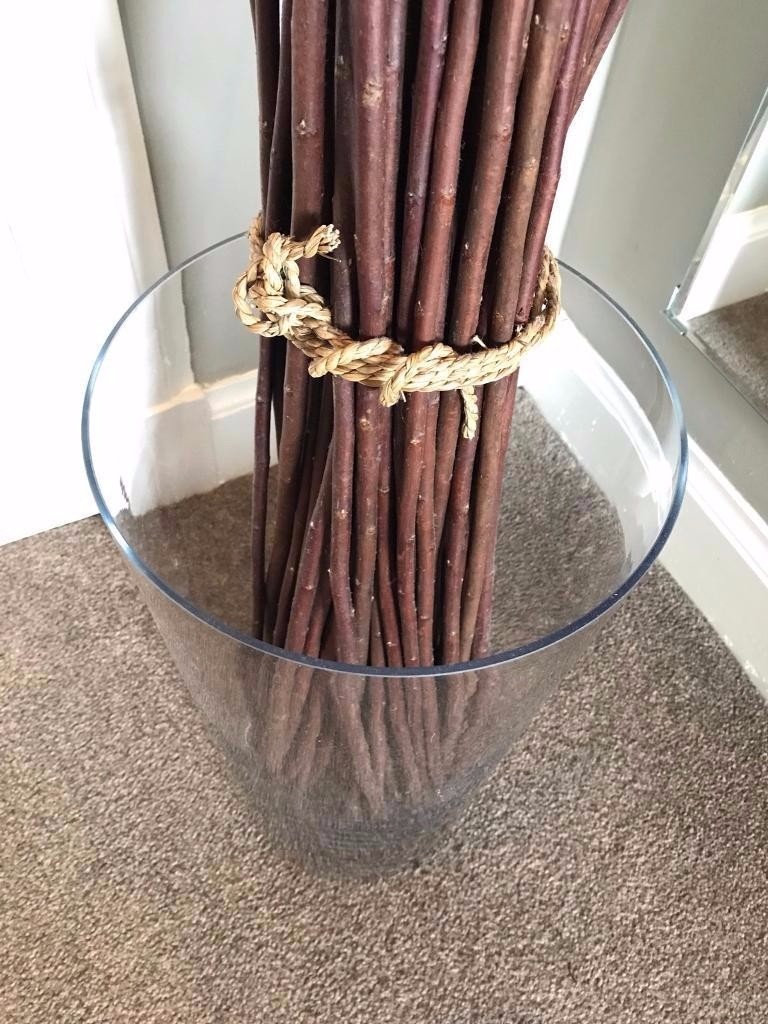 IKEA decorative tied willow branches in large glass vase. In great