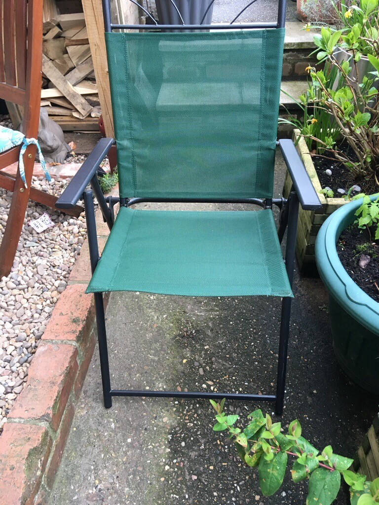 Green folding garden chairs and matching umbrella in Lincoln