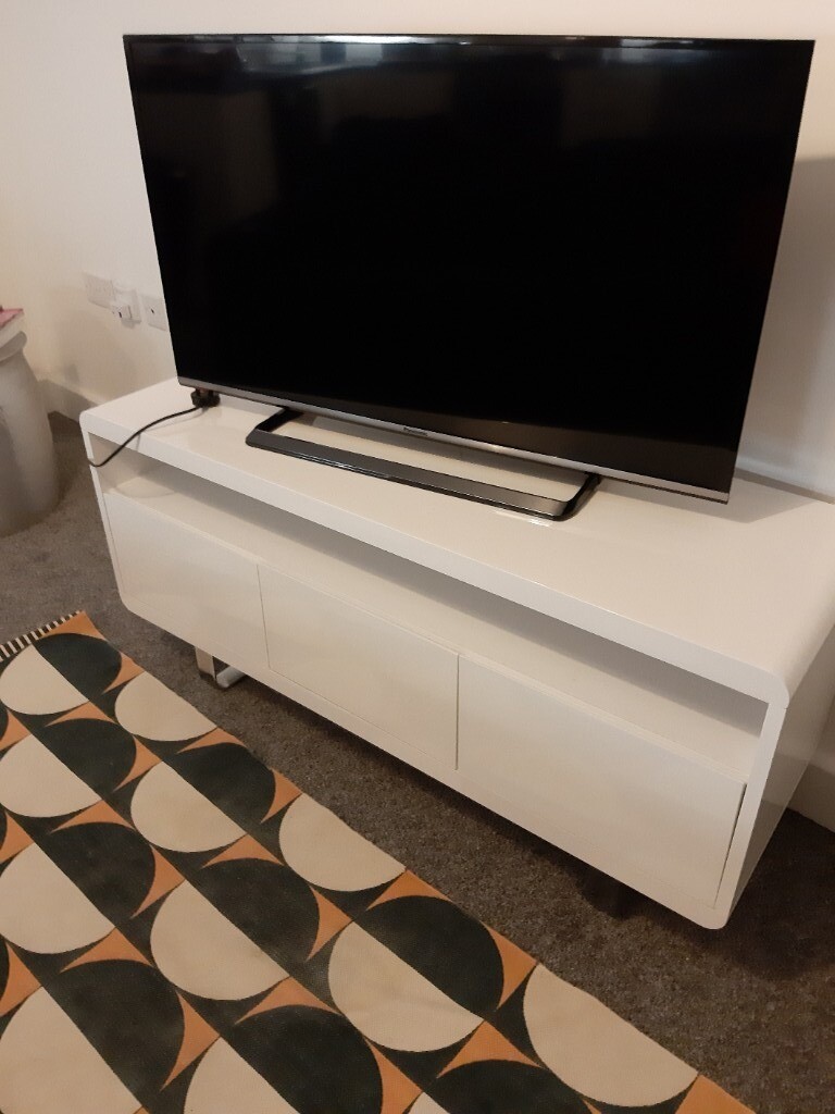 White gloss TV sleigh style from argos. 2 cupboards and 1