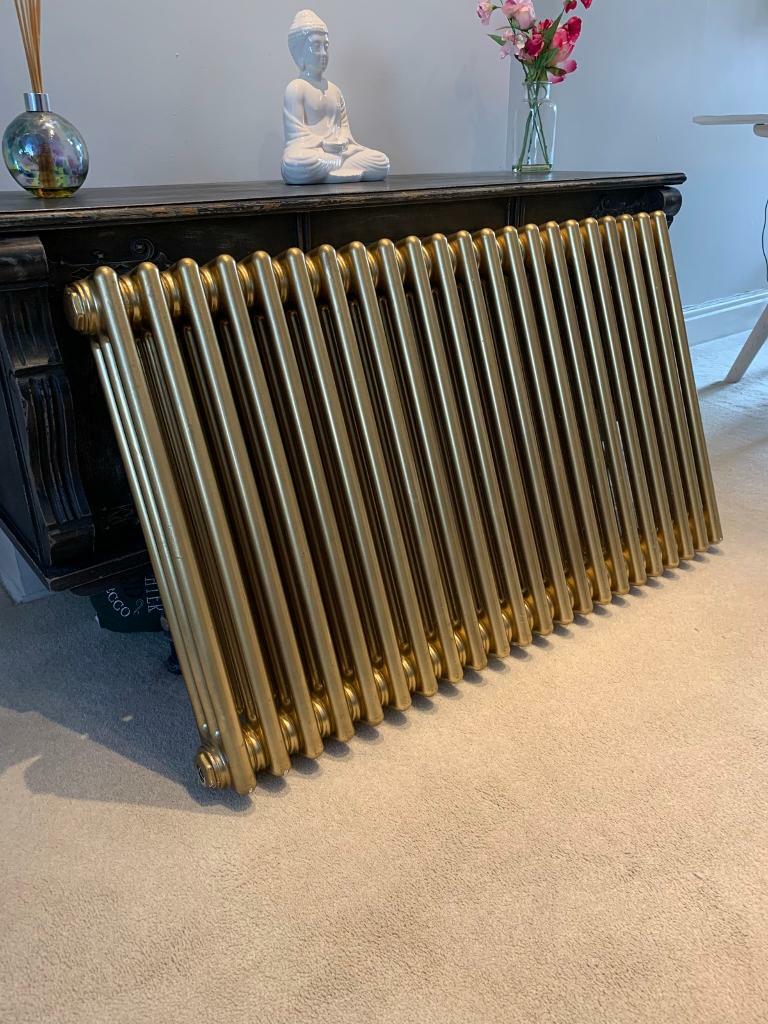 Gold horizontal three column radiator in Cheltenham, Gloucestershire