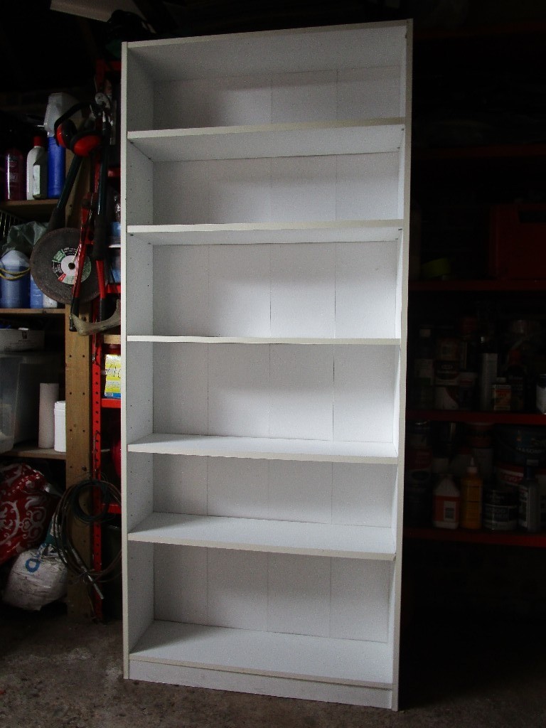 Tall, white formica book/display case with 6 shelves in Hereford