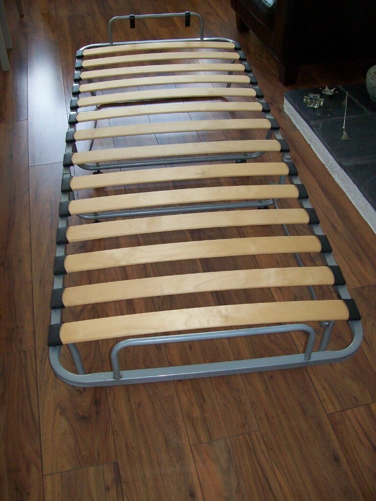 Ikea folding guest bed. Easily transportable with castors. VGC L190cm