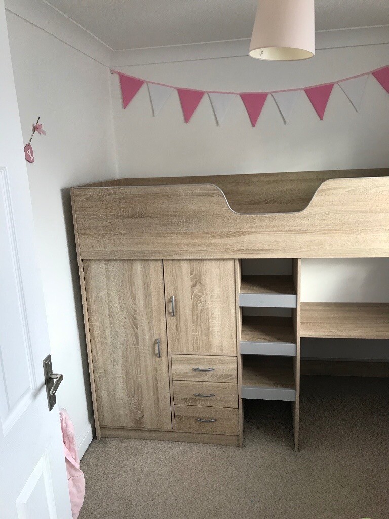 Cabin bed Light oak in colour. Desk, wardrobe and 3 drawers. Built in