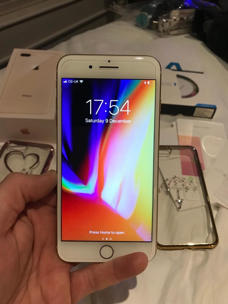 IPhone 8 Plus Gold 64gb with new wireless charger, box , unused headphone all accessories cases