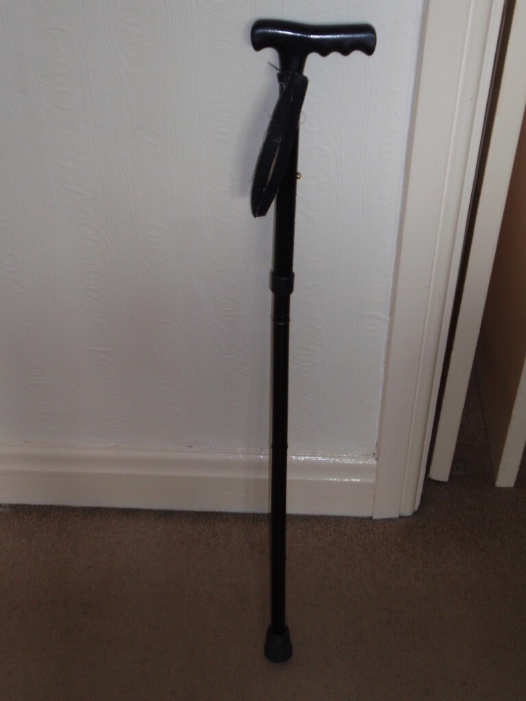 Black adjustable height walking stick with wrist strap | in Burnage