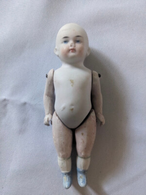 4 5/8'' Bisque Stiff-neck type girl doll, Stamped with No. 5012 over R or B