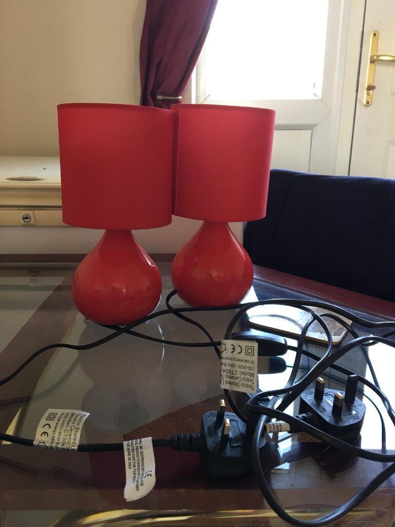 Pair of small red lamps bedside lighting with bulbs in Coggeshall