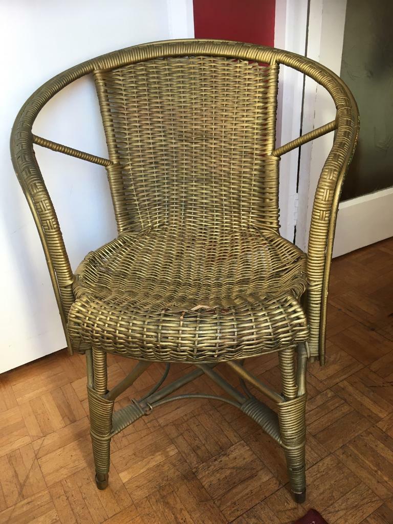 Childs gold coloured wicker chair. Minor wicker damage. Can be fixed