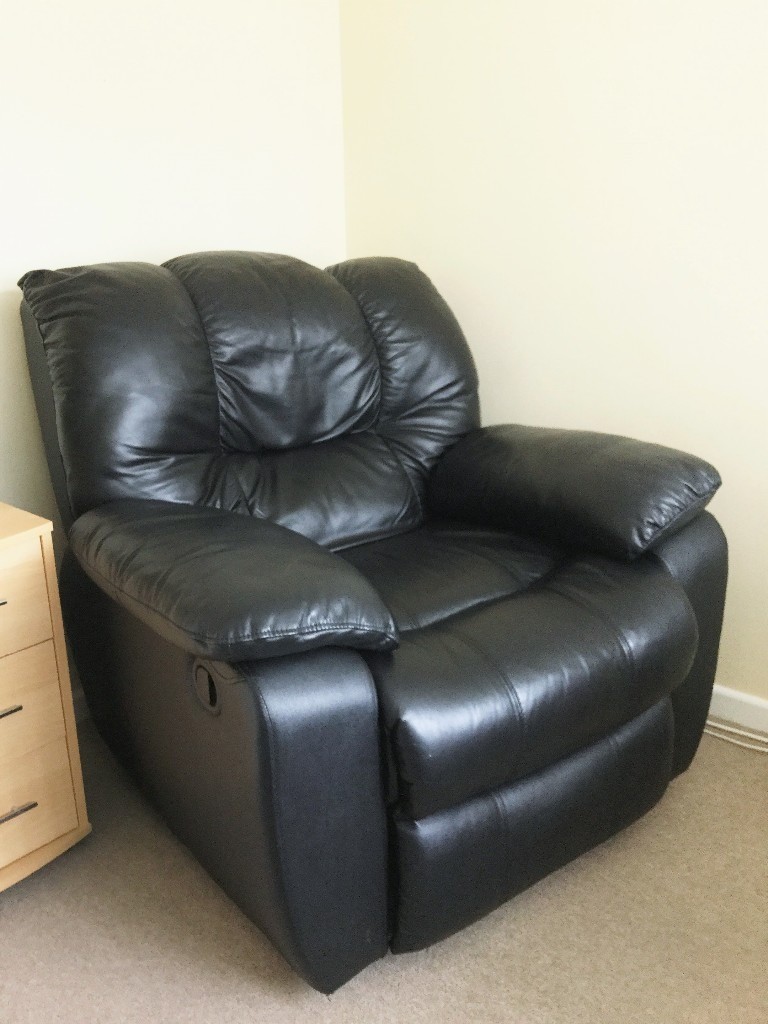 Black leather recliner chair wonderfully comfortable ideal for