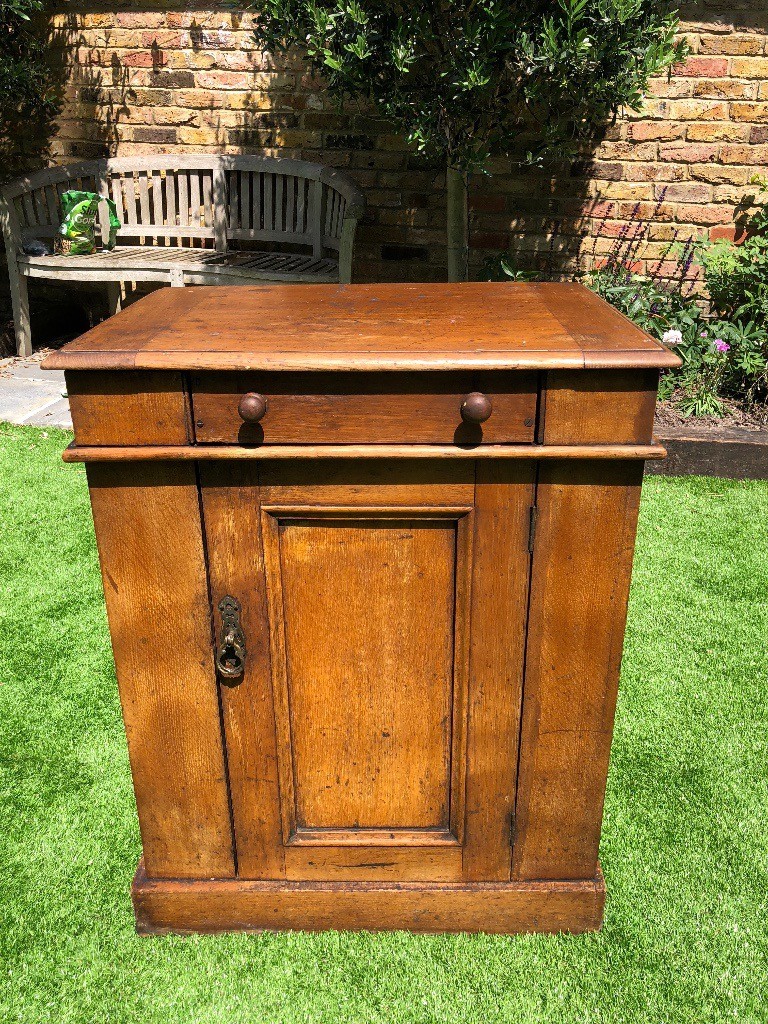Antique wooden wash stand that doubles up as a side table in