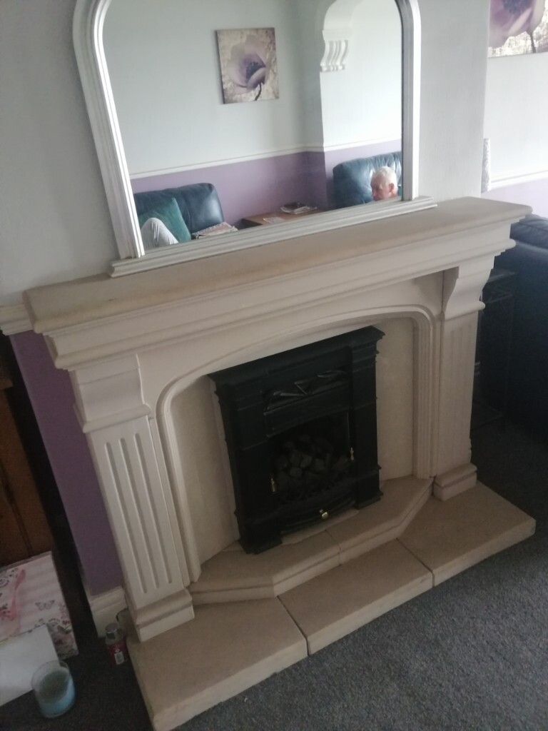 Natural solid stone fireplace with marble back and black gas fireplace