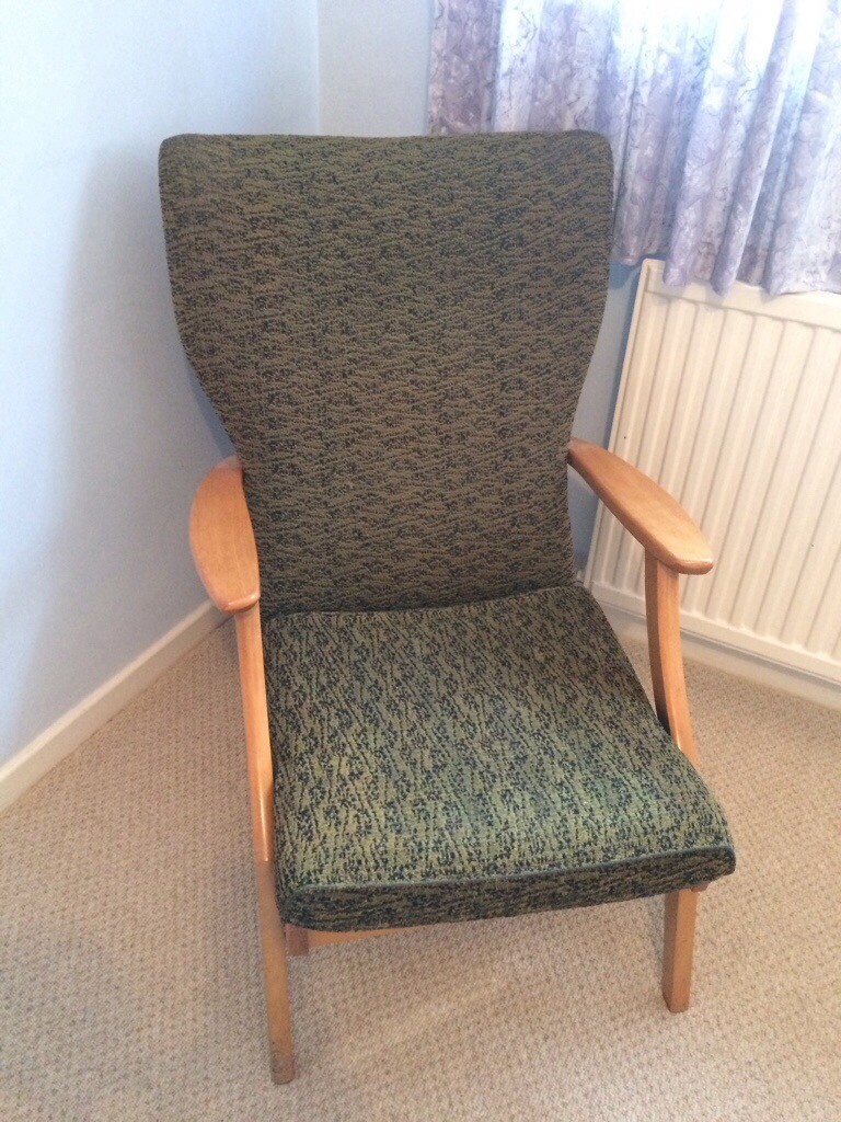 Vintage green and black fireside chair with wooden arms in Thornhill