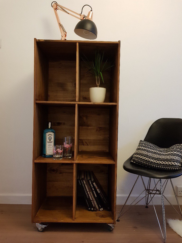 Rustic industrial reclaimed wooden bookcase on wheels. Vertical or