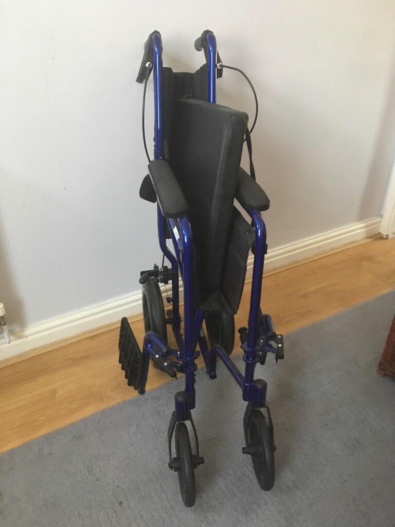Electric blue folding wheelchair in NewcastleunderLyme