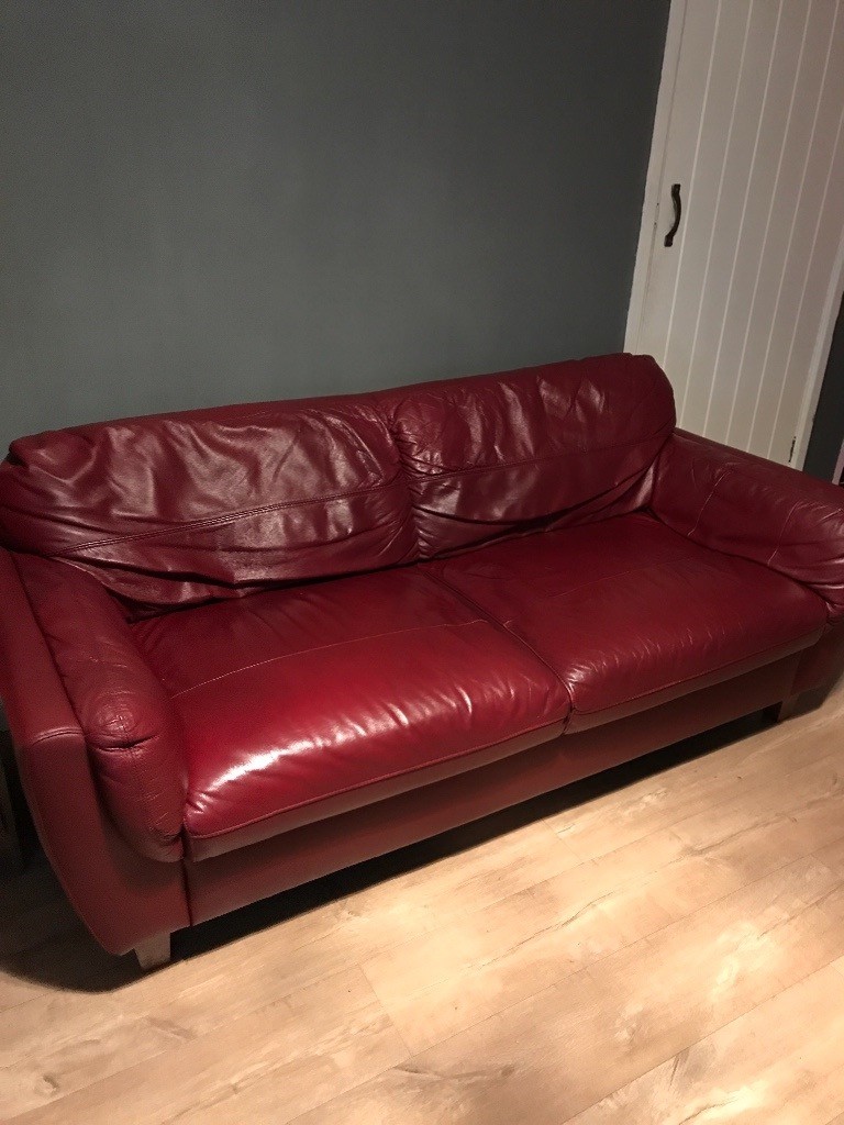 Red leather 3 seater sofa good condition plenty of wear left in it