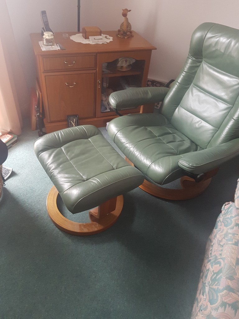 2 green leather recliner chairs with matching footstools in Arbroath