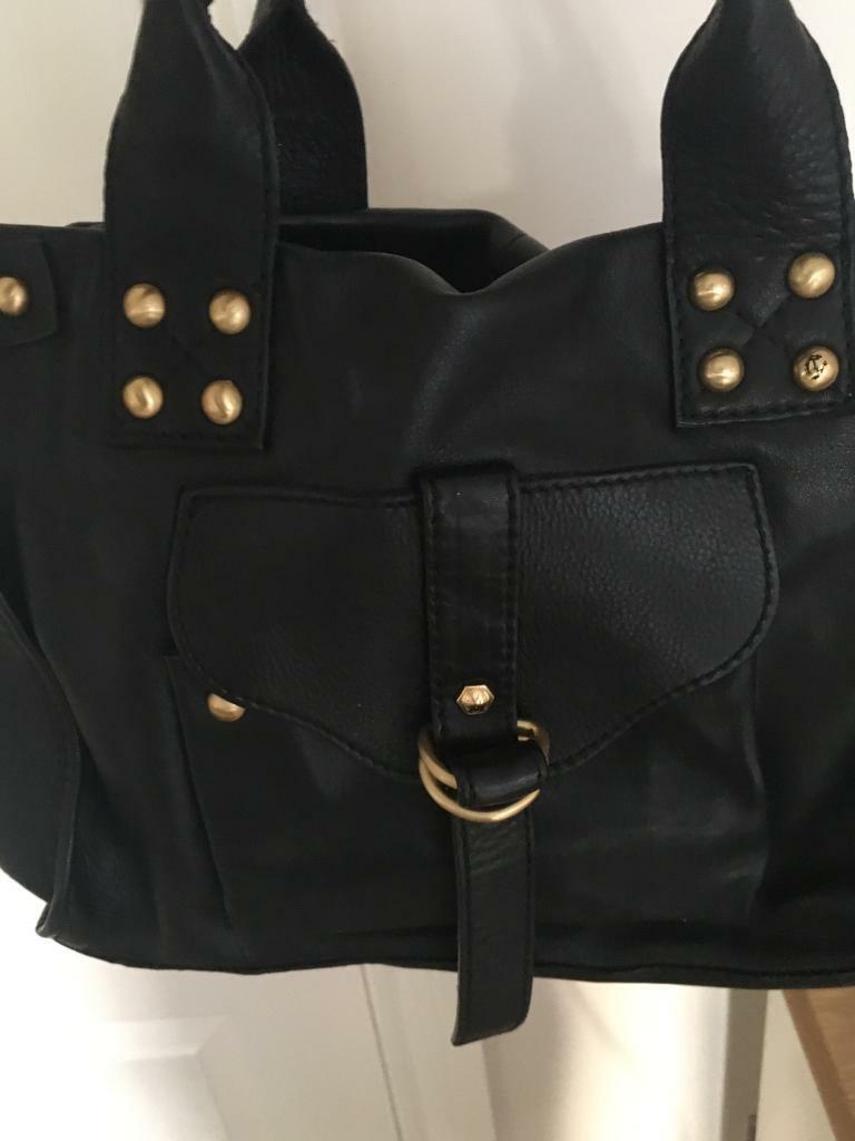 Handbag black real leather with gold studs and zip fastener in