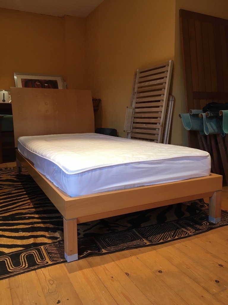 Two stylish Ligne Roset beech frame single beds including mattresses