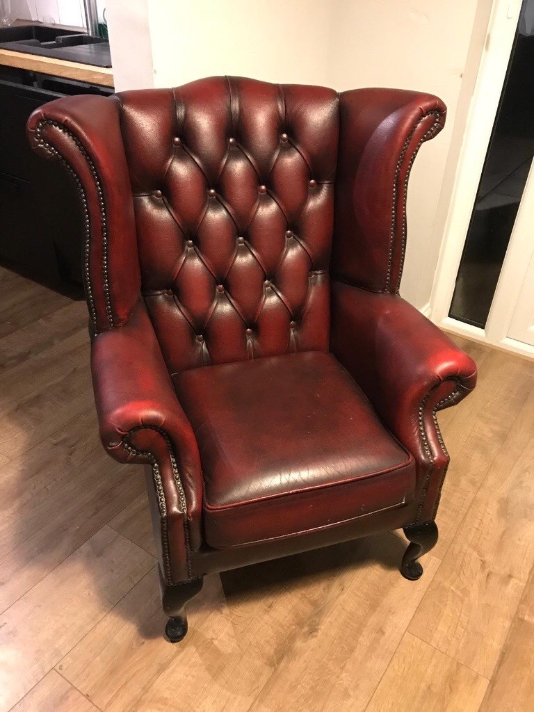 Oxblood red leather Chesterfield high back armchair in Royal Wootton