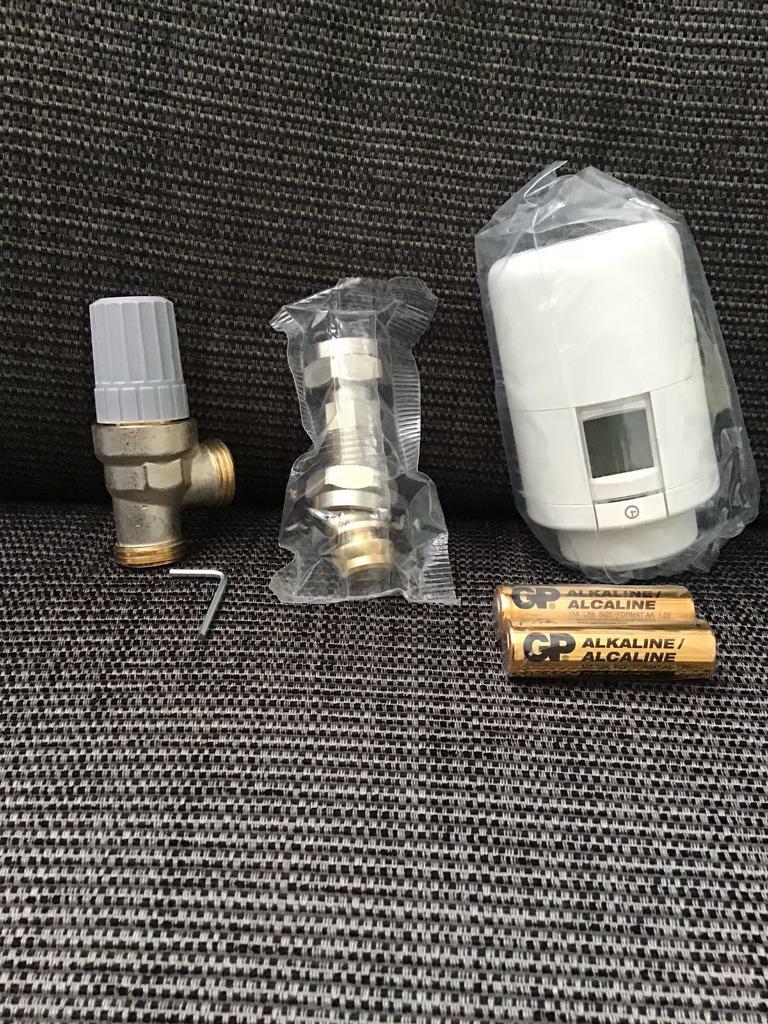 Two Hive smart heating thermostatic radiator valves with smart phone