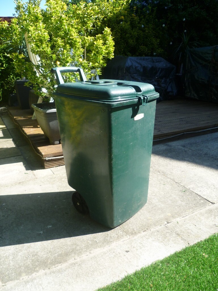 green curver plastic mini wheeled wheelie bin in Atherton, Manchester