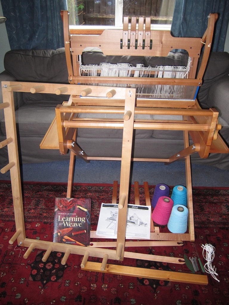 Ashford weaving loom, stand, warping board and lots of extras table