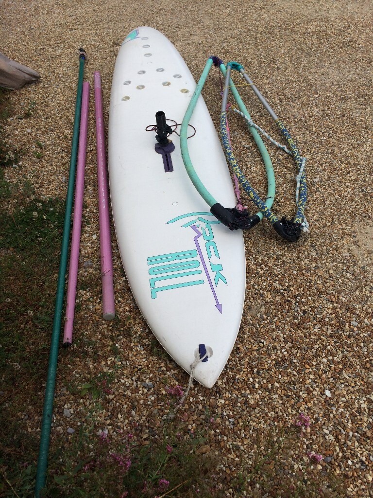 Windsurf board with mast, boom, 2 sails plus a childs mast and boom