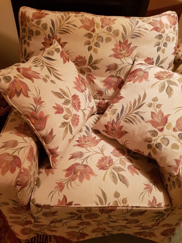 Large armchair with floral loose covers, cushions and matching