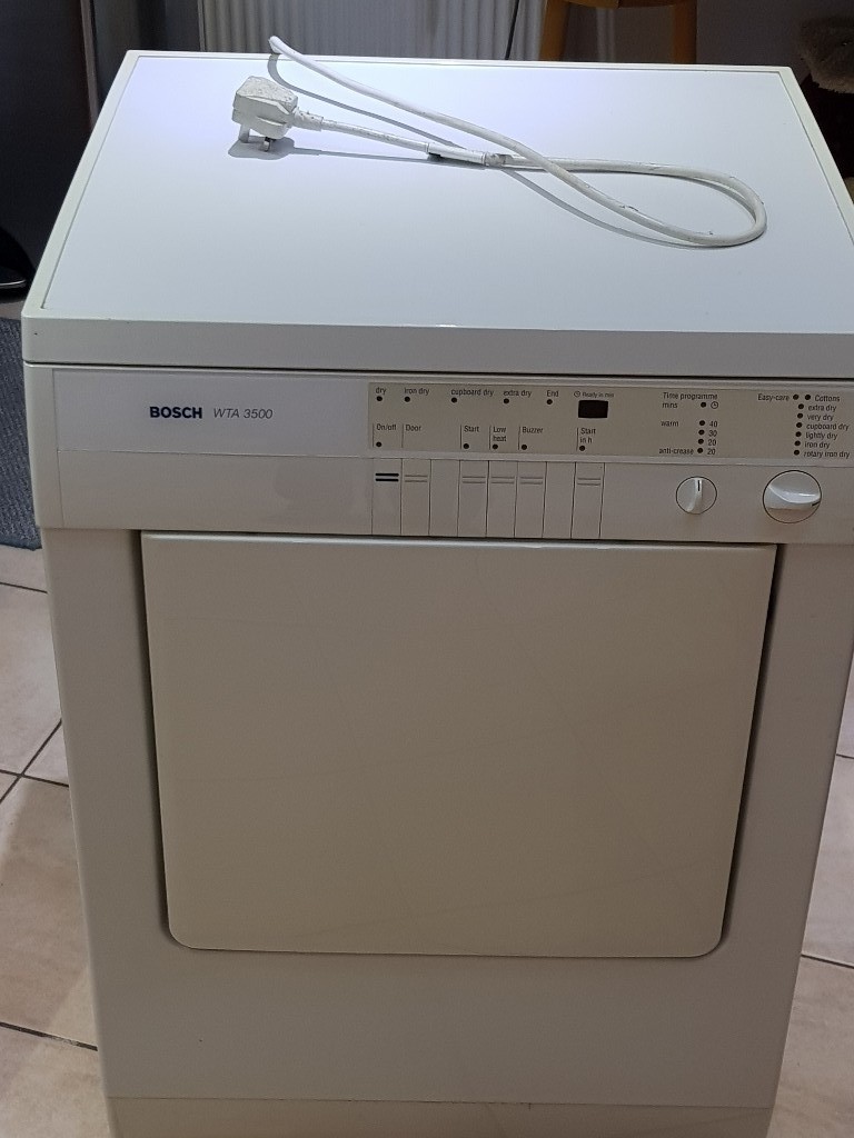 Bosch tumble dryer WTA3500 noisy and working, could be for repair or parts in Grayshott