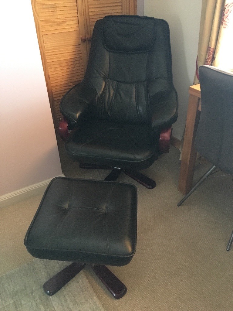 Leather Chair with footstool . In very good condition, barely used. Chair reclines with small