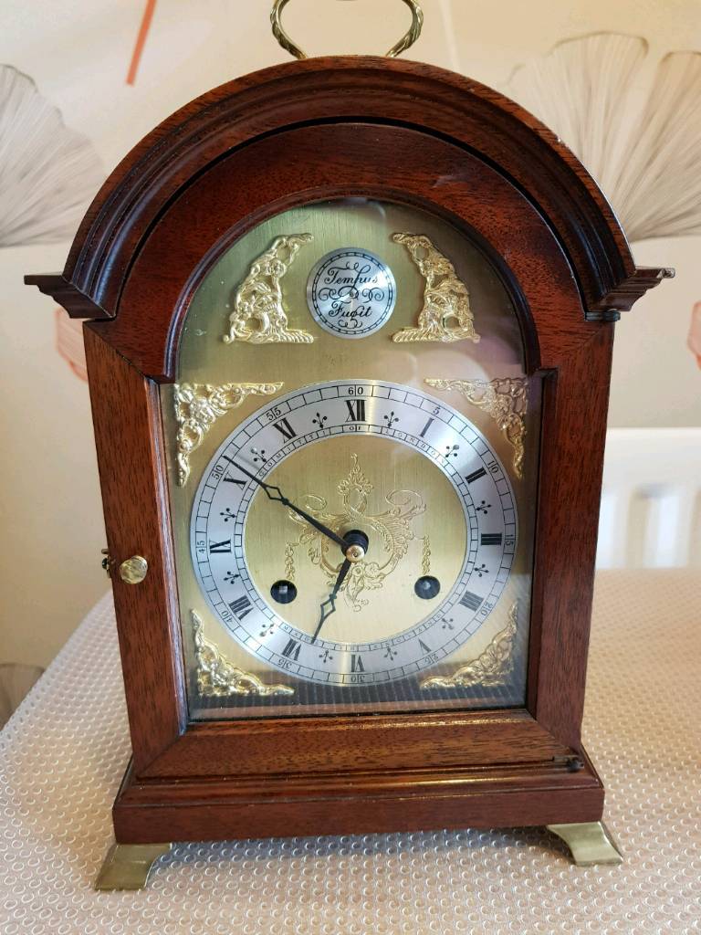 Dark wooden cased mantle clock Comitti of London in SuttononHull