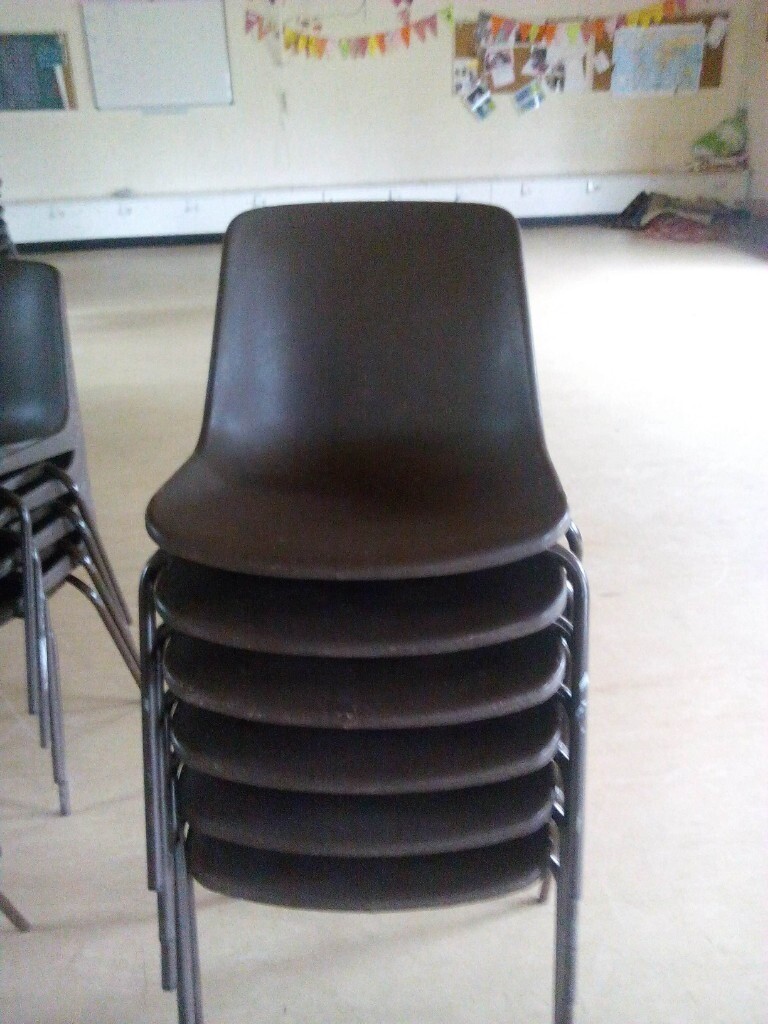 Vintage school or community hall style brown plastic chairs with metal