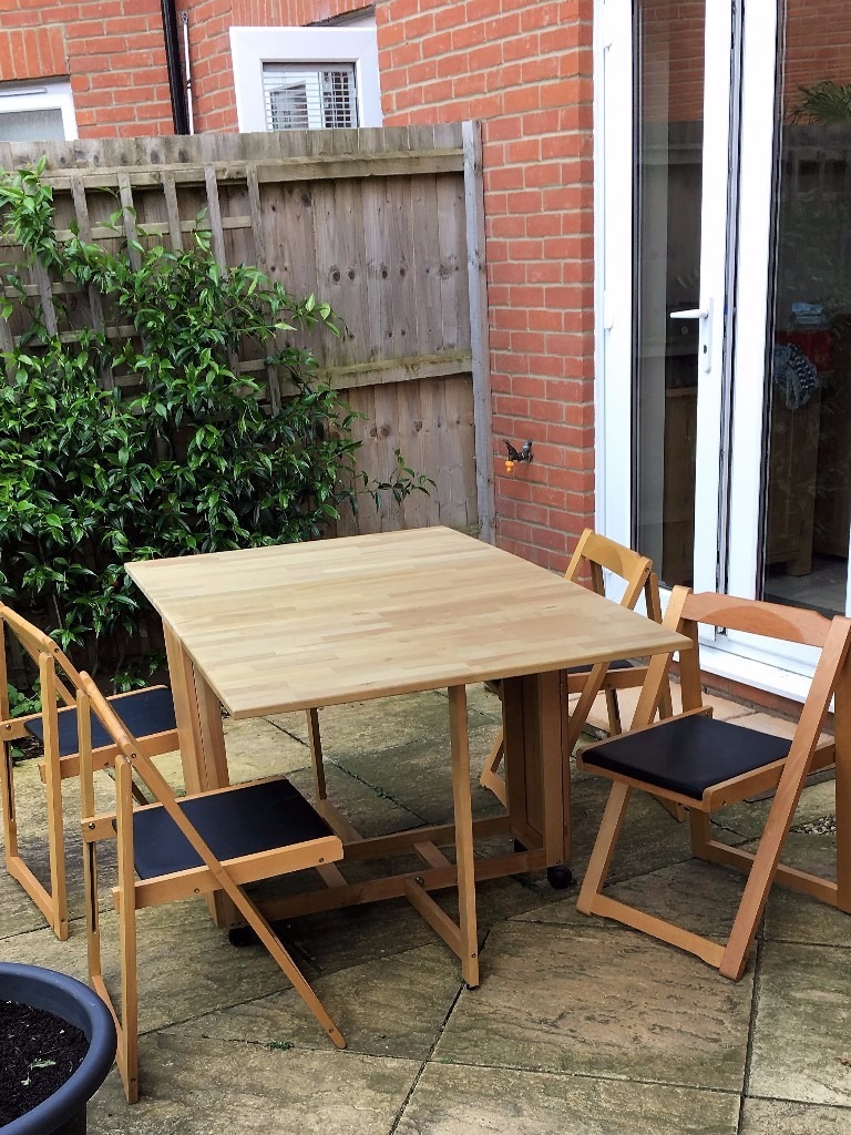HEARTLANDS BUTTERFLY DROP LEAF FOLDING DINING TABLE AND FOUR CHAIRS in Costessey, Norfolk