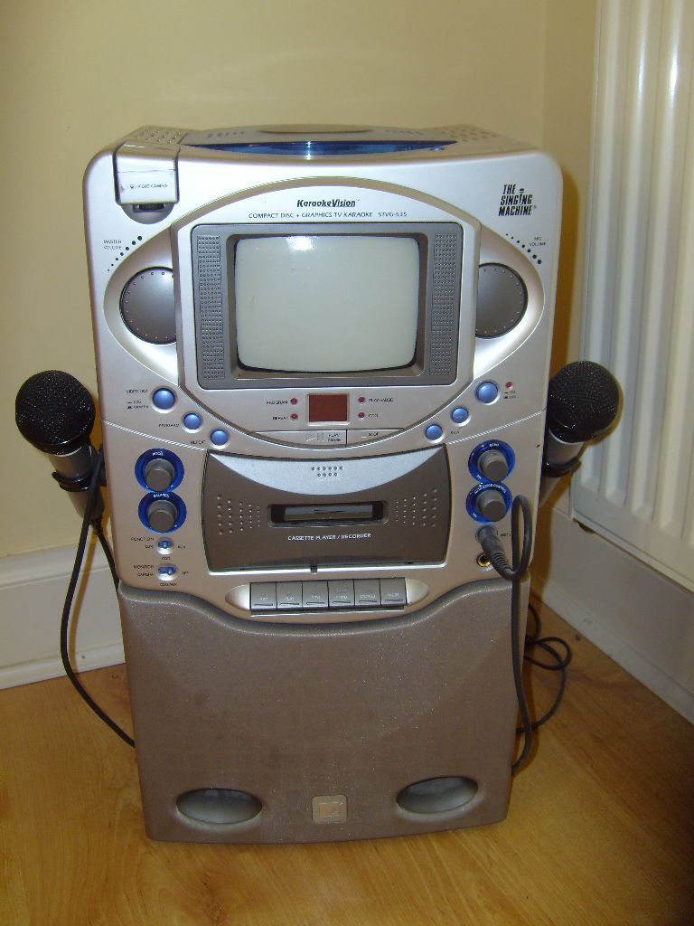 The Singing Machine karaoke CD/cassette player with 2 microphones