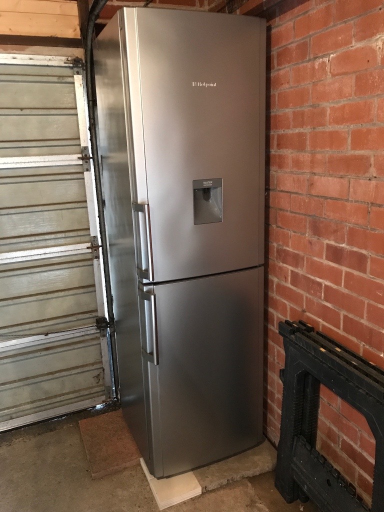 Hotpoint Fridge Freezer with water dispenser. 2m tall great condition only 2 years old. in