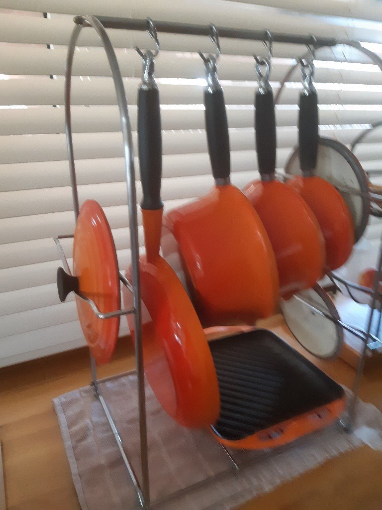 Le Creuset pan set with small grill on a lovely chrome Le Creuset rack
