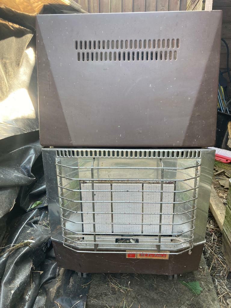 Old fashioned gas heater and gas bottle in Mountsorrel