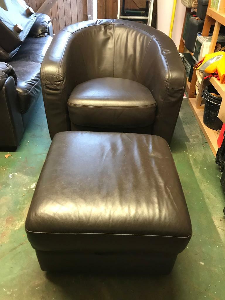 Dark brown faux leather tub chair with foot stool in Ipswich, Suffolk