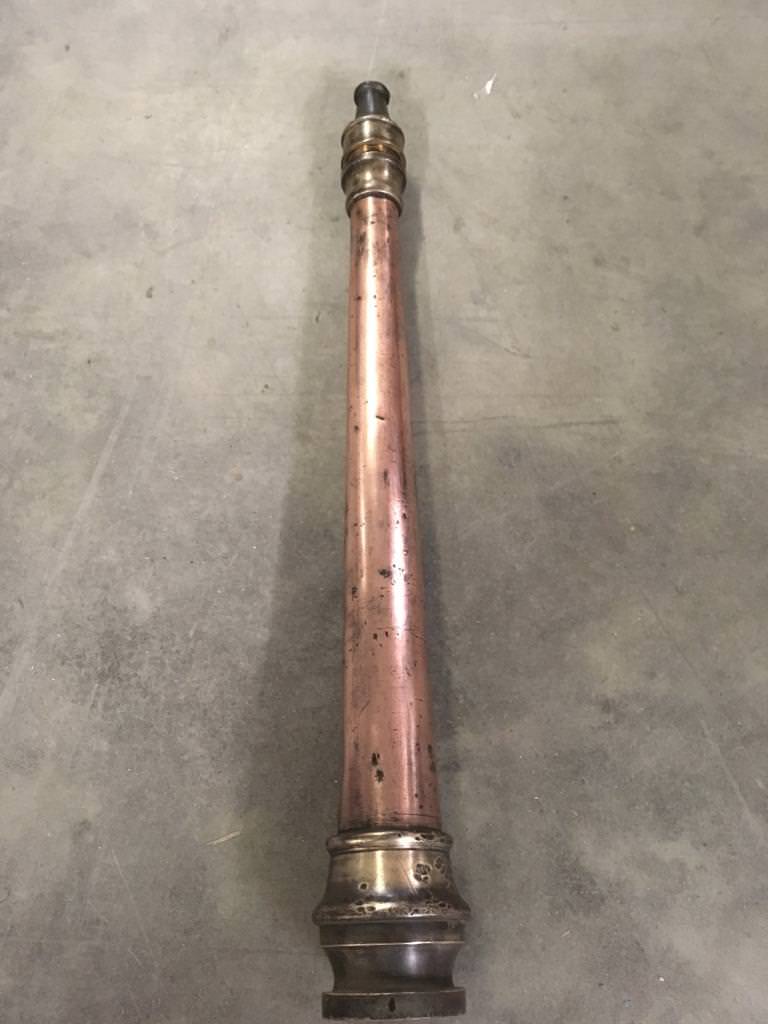 Vintage copper and brass fire hose nozzle in Stamford Bridge, North