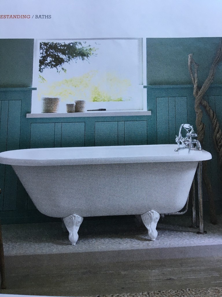 Claw foot roll top freestanding bath. Bath shower mixer tap. Vanity