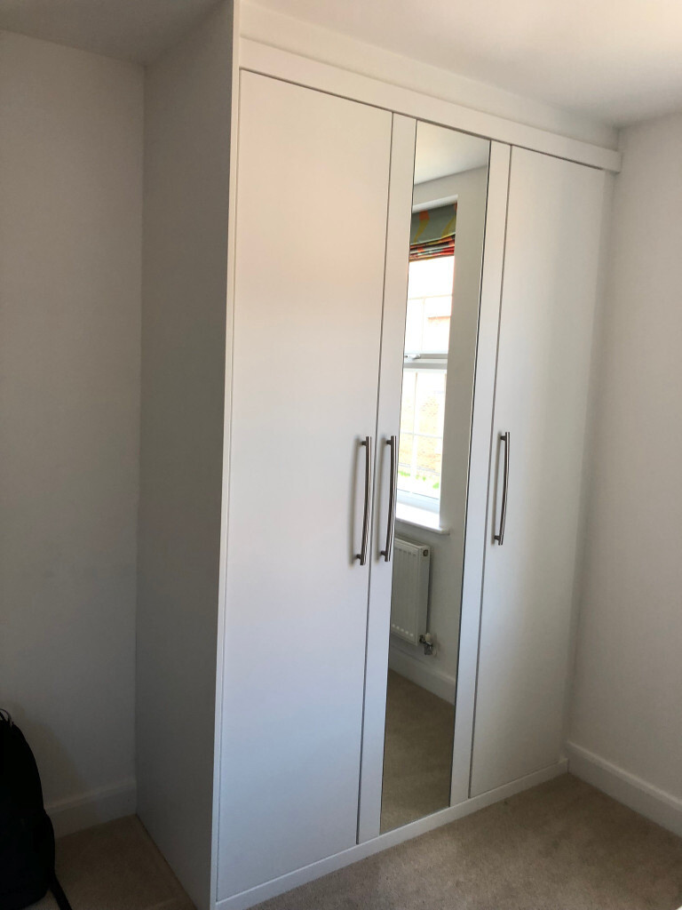 Two Symphony Fitted Wardrobes In White In Nottingham